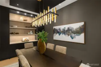 Built in cabinetry, display shelves, curated light fixture and expansive windows.