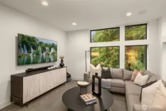 Upstairs media room with floor to ceiling windows.