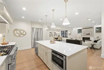 Custom chef kitchen with high end commercial appliances compliments this open concept living area.