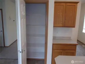 Extra food storage space in kitchen pantry.