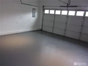 Fully sheet rocked and freshly painted garage with garage door opener.