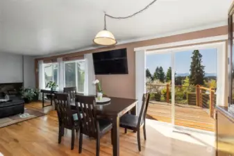 One possible Dining area options. TV Conveys! Slider out main level deck with gorgeous Mountain views!