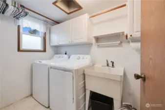 Spacious utility room is on the lower level off the family room~