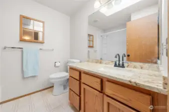 Upstairs bathroom has a tub/shower combo