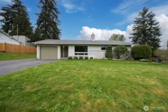 Home sits up on a large corner lot with great exposure