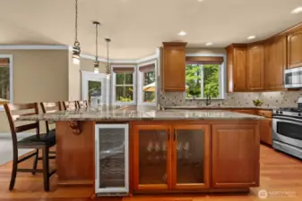 check out built in wine cooler and custom cabinet to show off your glasswear.