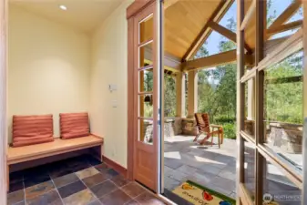 Airlock foyer offers functionality with style and seasonal comfort.