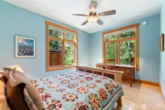 Elegant guest bedroom on the main floor, ideal for visiting friends and family.