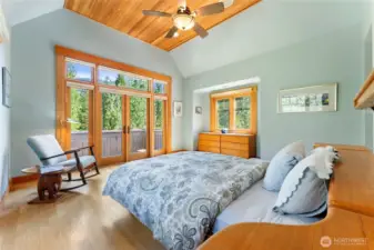 Upstairs primary suite with private balcony and big sky views.