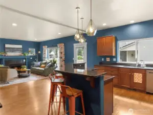 Great flow from the kitchen to the family room. The door leads to the deck and space to grill.