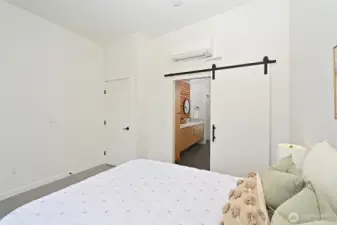 Closet space and barn-door to Primary Suite bath.