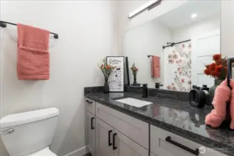 Full bathroom near bedrooms.