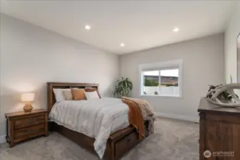 Spacious primary suite with room to unwind.