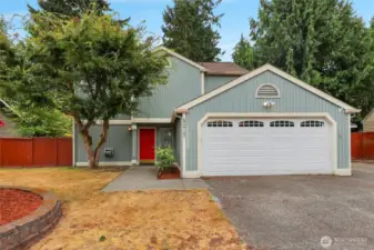 Mature landscaping in front yard.