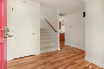 Stairway to 2 bedrooms and full bath