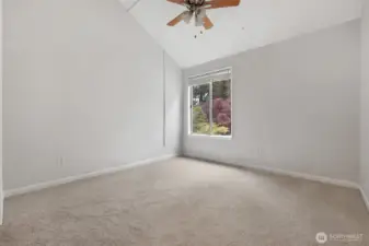Primary bedroom with walk in closet and en suite bathroom