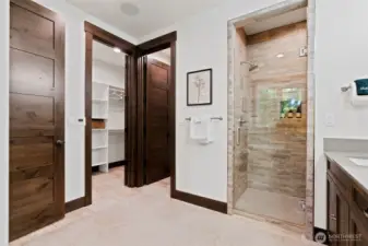 Primary walk in shower and closet
