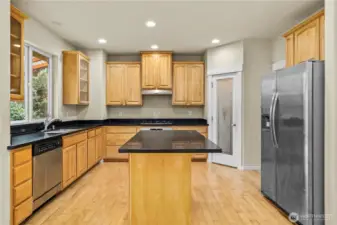 Conversational Kitchen with walk in pantry and island.