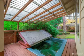 Once a great covered hot tub area, this shows the potential that can be rebuilt by the new buyer.  (Hot tub does not work)