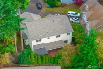 Aerial view shows the newer roof and private backyard.