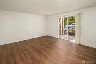 Living Room leads to covered patio w/storage