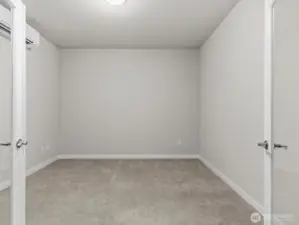 Nearby is the private home office with French doors.