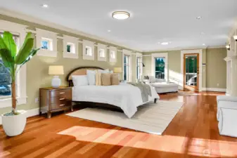 The primary bedroom opens to a covered private deck through the door in this photo