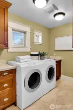 Elegant finishes are even found in the upper level laundry room