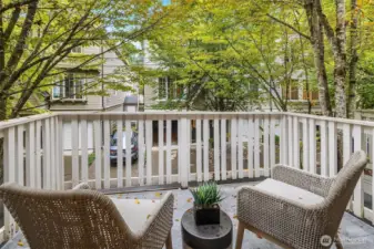 Private balcony overlooking mature trees.