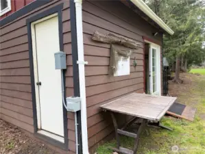 She-shed with french doors or back door.  30amp RV hookup.