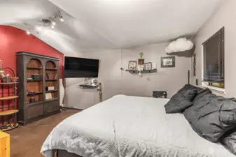 Vaulted ceiling and hidden storage throughout this space with access to full bath.