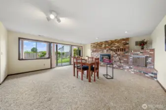 Lower level features a large recreational room with gas fireplace and slider to the backyard.