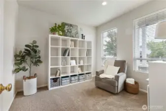 Multiple-use room right of entry.  This could make a great office, reading room, play room or nursery.