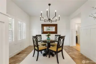 Classy dining room with 3.5 inch interior shutters and wainscoting panels.