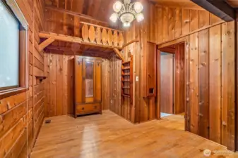 The first bedroom upstairs comes with a few surprises—direct access to the Jack & Jill bath, a walk-in closet hiding a tiny secret door to storage and attic space, and a loft tucked overhead with no way up (yet). Fully wrapped in cedar, it feels like a cozy hideaway with a few mysteries built in.