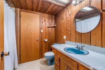 Linking the two upstairs bedrooms, this shared bath has great bones but is ready for a full re-do. Think of it as a blank canvas—waiting for fresh style to match the cedar-lined charm around it.