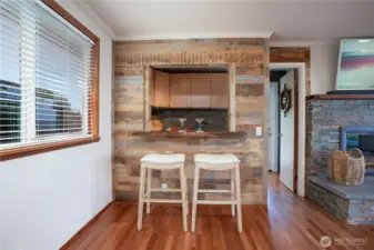 Cool wet bar for entertaining with refrigerators included and lots of storage space.  Door to the deck.