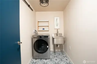 Downstairs laundry has a new washer/dryer combo.   If you wanted to have a kitchen you could use the bedroom next door.