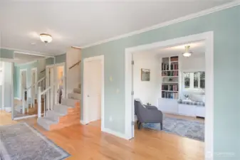 Back to entry w/ library to the right and main floor bedroom w/ 3/4 bath down the hall.
