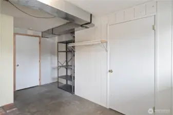 Basement w/ doors to shop & 10x 12 storage  room w/ cedar lined closet.