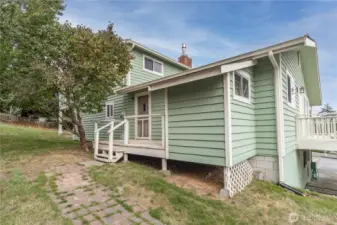 Backdoor next to kitchen/ laundry area.