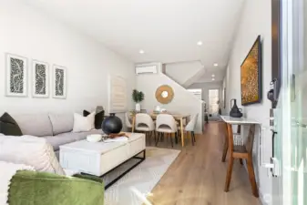 Step inside and feel the difference—an open-concept main floor designed for connection, comfort, and your favorite home rituals. (photo is of model home lot 17)