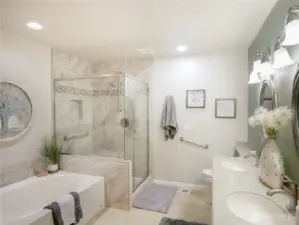 Updated 5 piece bathroom featuring a soaking tub, walk in shower and double sinks.