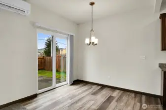 Dining Area with Luxury Vinyl & Slider to Patio