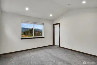 Primary Bedroom with Mini-Split, Vaulted Ceilings view toward the Bath