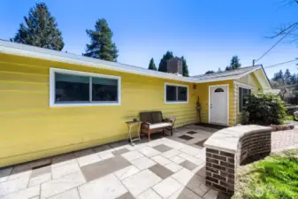 The front entry boasts a level, custom patio.