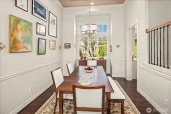 The semi formal dining room off the kitchen & living room & lovely views looking into the backyard