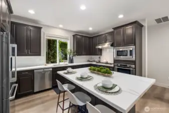 A handsome kitchen with useful island.