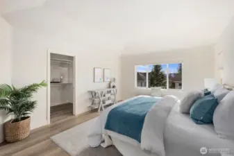 Back in the primary looking towards the walk-in closet.