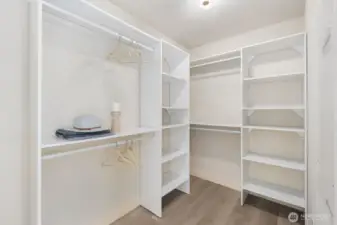 A partial view of the walk-in closet in the primary.